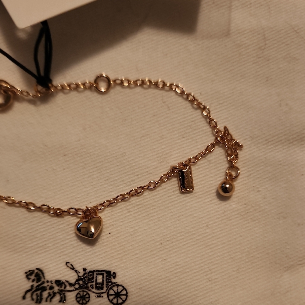 Coach Gold-Tone Delicate Charm Bracelet - Picture 4 of 7